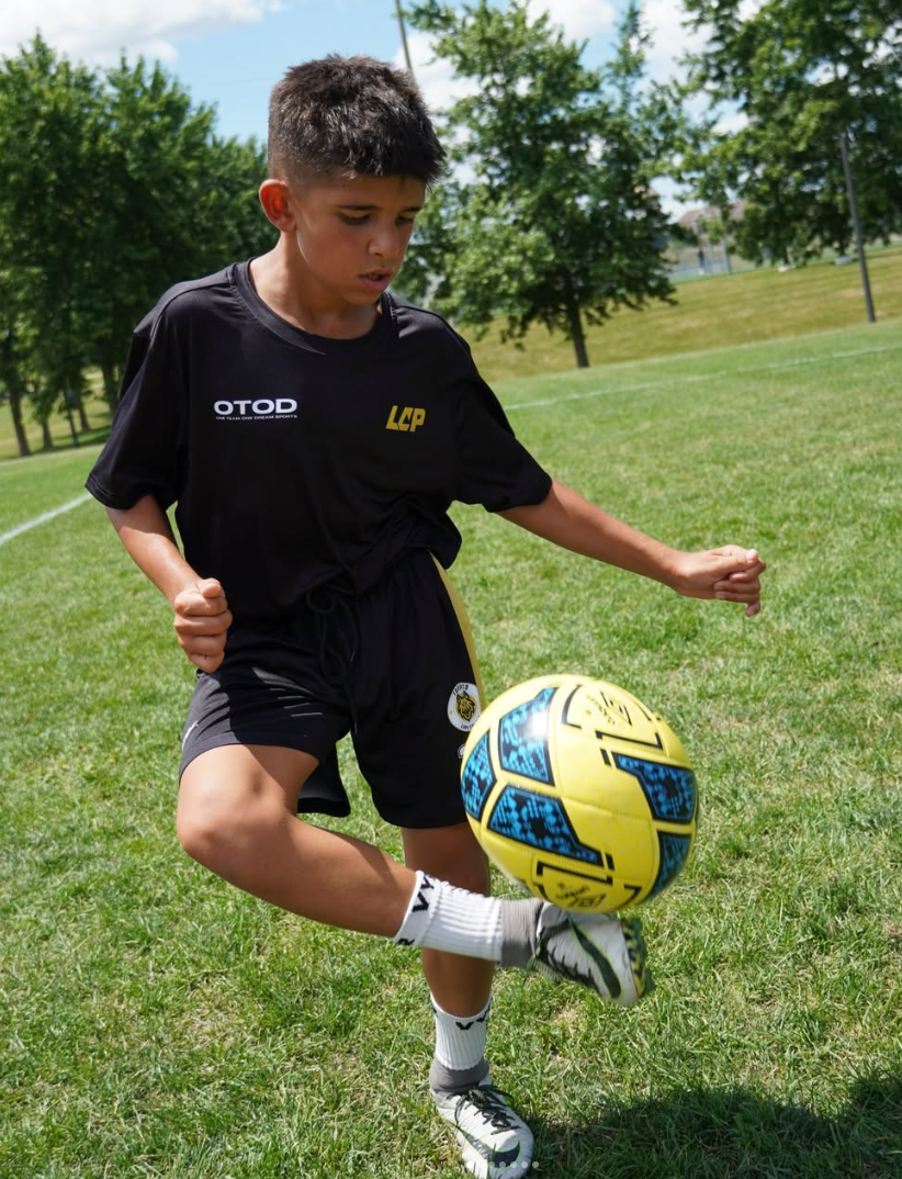 Young athlete juggling the ball in LCP training kit