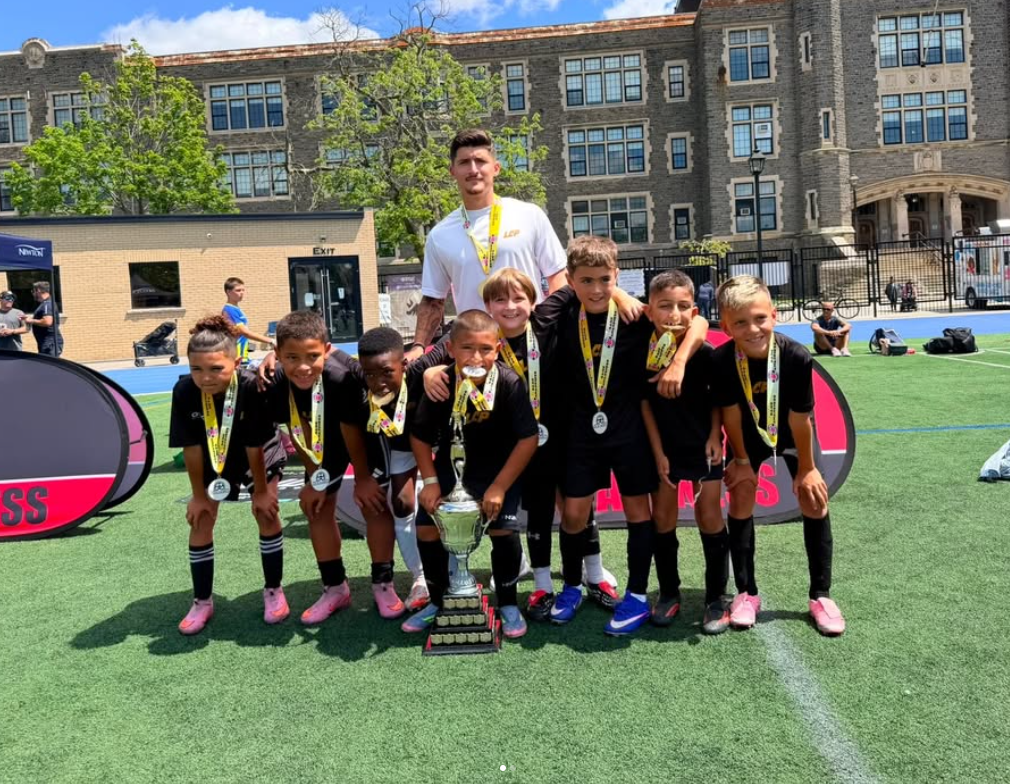2017 boys celebrating their 5v5 tournament win with the trophy